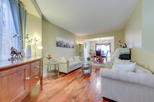 Bright formal living room at 3364 Ingram Rd. with hardwood flooring, large front window and adjoining dining room.