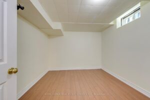 Finished basement bonus room suitable for a home office, gym or storage.