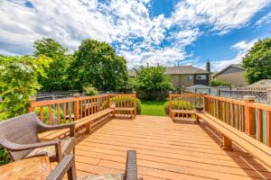 Spacious backyard deck with built-in bench seating overlooking the private, landscaped backyard at 3364 Ingram Rd., Mississauga.