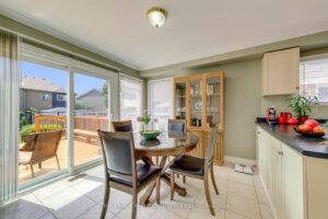 Sunny breakfast area overlooking the backyard deck with patio doors at 3364 Ingram Rd.
