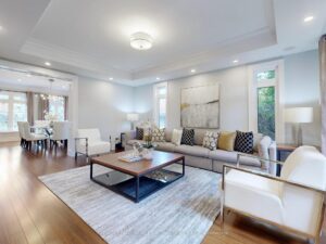 Bright living room with large windows, contemporary furnishings, and open-concept design.