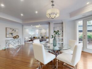 Breakfast area with contemporary lighting and walkout access to the backyard.