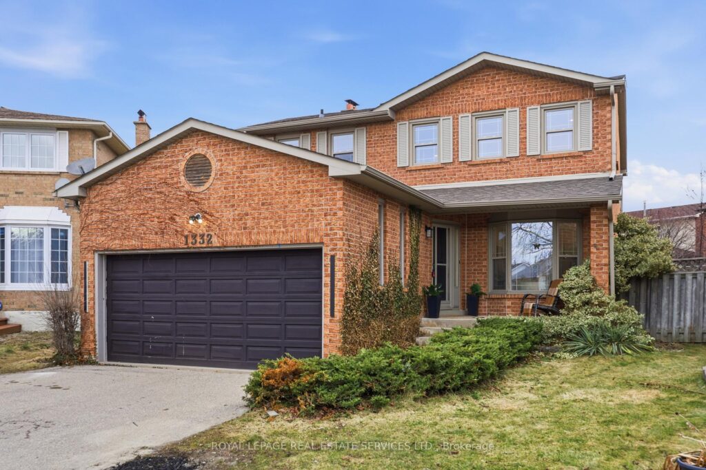 Beautifully renovated two-storey brick home with double garage, landscaped front yard and covered entry.
