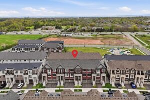 Aerial view of the townhouse highlighting its location within a modern residential community.