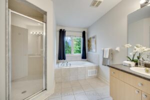 Luxury primary ensuite at 2249 Glazebrook, Mississauga, with a glass shower, soaker tub, and large vanity.