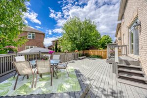 Large composite-style backyard deck at 2249 Glazebrook, Mississauga, with generous entertaining space and landscaped surroundings.