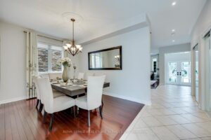 Formal dining room at 2249 Glazebrook, Mississauga, with hardwood flooring and ample space for entertaining family and guests.