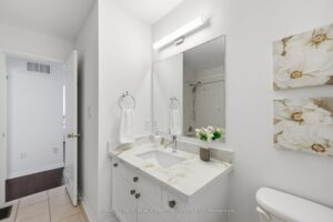 Bright bathroom with vanity, bathtub, and contemporary finishes.