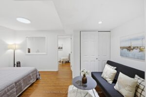 Finished basement room with flexible living space and contemporary décor.