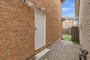 Separate side entrance providing convenient access to the finished basement.