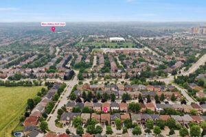 Elevated aerial view showcasing nearby parks, streets, and community amenities.
