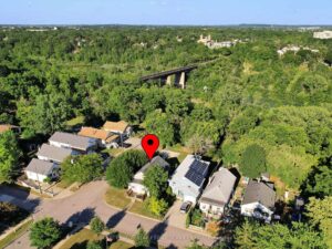 Aerial view of the property surrounded by mature trees in a desirable neighbourhood.