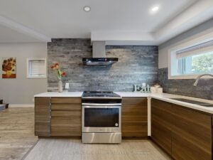 Stylish kitchen with quartz countertops, stainless steel range, and contemporary finishes.