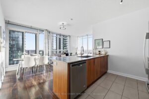 Bright living and dining area with open-concept layout and abundant natural light.