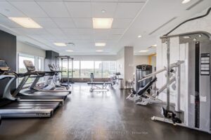 Fully equipped fitness centre with cardio machines and strength-training equipment.