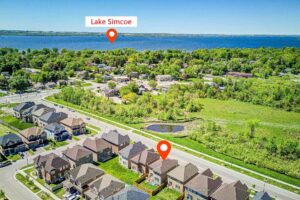 Aerial view of the neighborhood highlighting the home's location just minutes from Lake Simcoe.