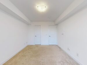 Bright bedroom with double closet, neutral décor, and ample natural light.