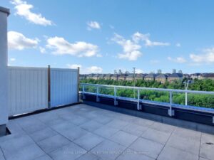 Expansive rooftop terrace overlooking green space with plenty of room for outdoor entertaining.