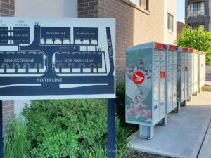 Community mailbox and parcel lockers located within the townhouse complex.