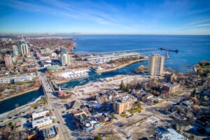 Aerial view of Port Credit marina, waterfront parks, Lake Ontario, and surrounding residential community.