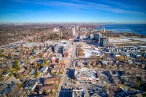 Aerial view of the Port Credit neighborhood with Lake Ontario, local shopping, and surrounding residential streets.