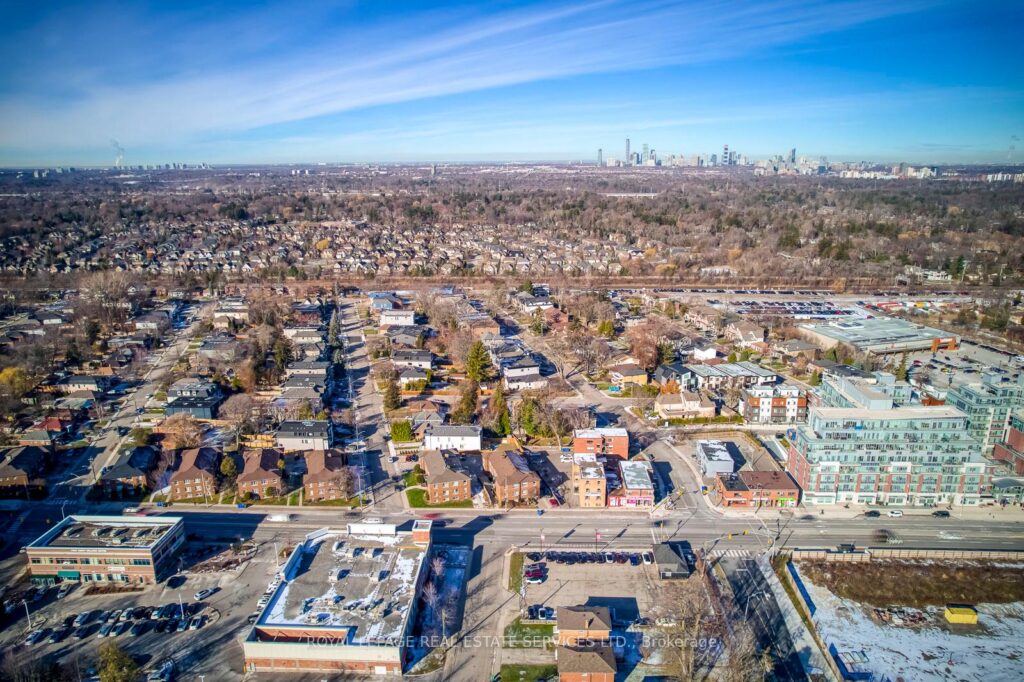 Overhead aerial view of the apartment building, parking areas, and surrounding Port Credit neighborhood.
