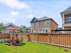 Backyard entertaining space with fully fenced yard.