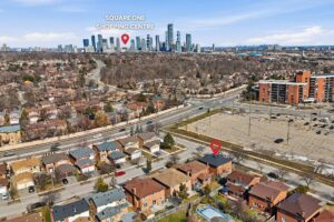 Aerial view overlooking the surrounding neighbourhood with Toronto skyline in the distance.
