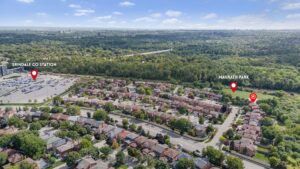 Aerial neighbourhood view highlighting nearby parks, schools, and surrounding amenities.