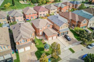 Aerial view of the detached home and surrounding East Credit neighbourhood.