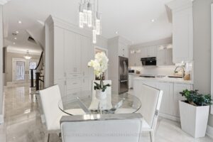 Bright breakfast area beside the kitchen with elegant lighting and open-concept layout.