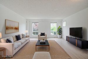 Spacious living room with modern furnishings and abundant natural light.