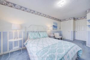 Spacious bedroom with double closet and abundant natural light.