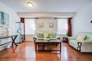 Comfortable living room with open-concept layout and hardwood flooring throughout.