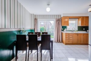 Dining area with sliding patio doors and convenient access to the adjoining kitchen.