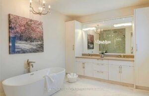 Spa-inspired bathroom with freestanding soaker tub and double vanity.